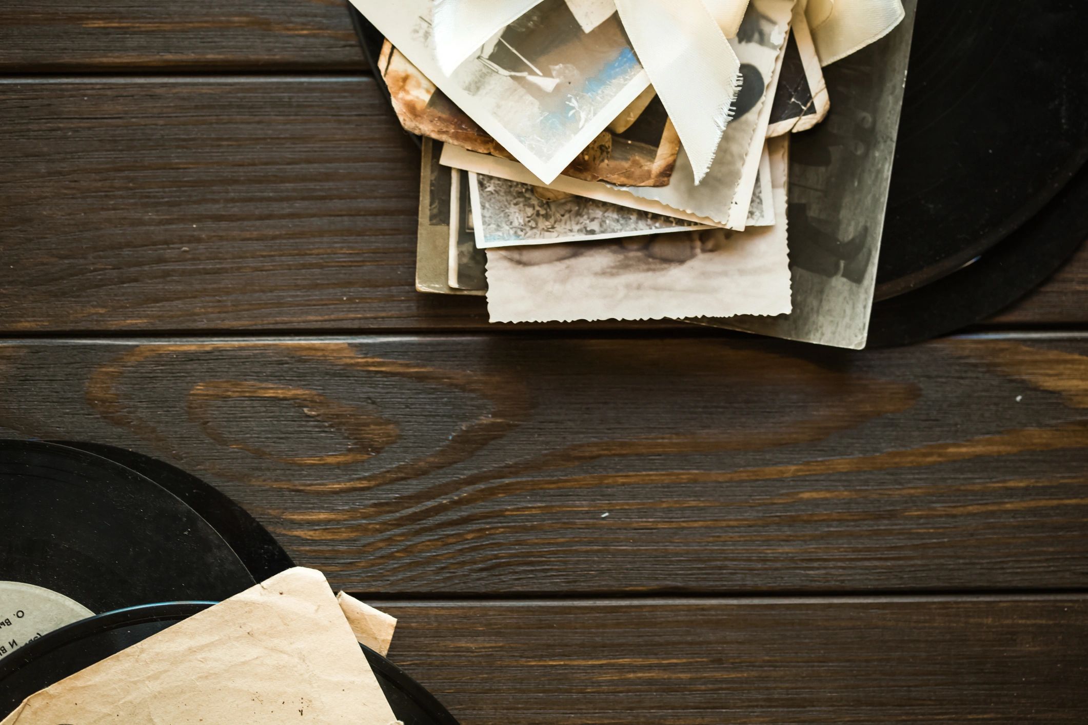 Vintage family photographs and genealogy papers on a table