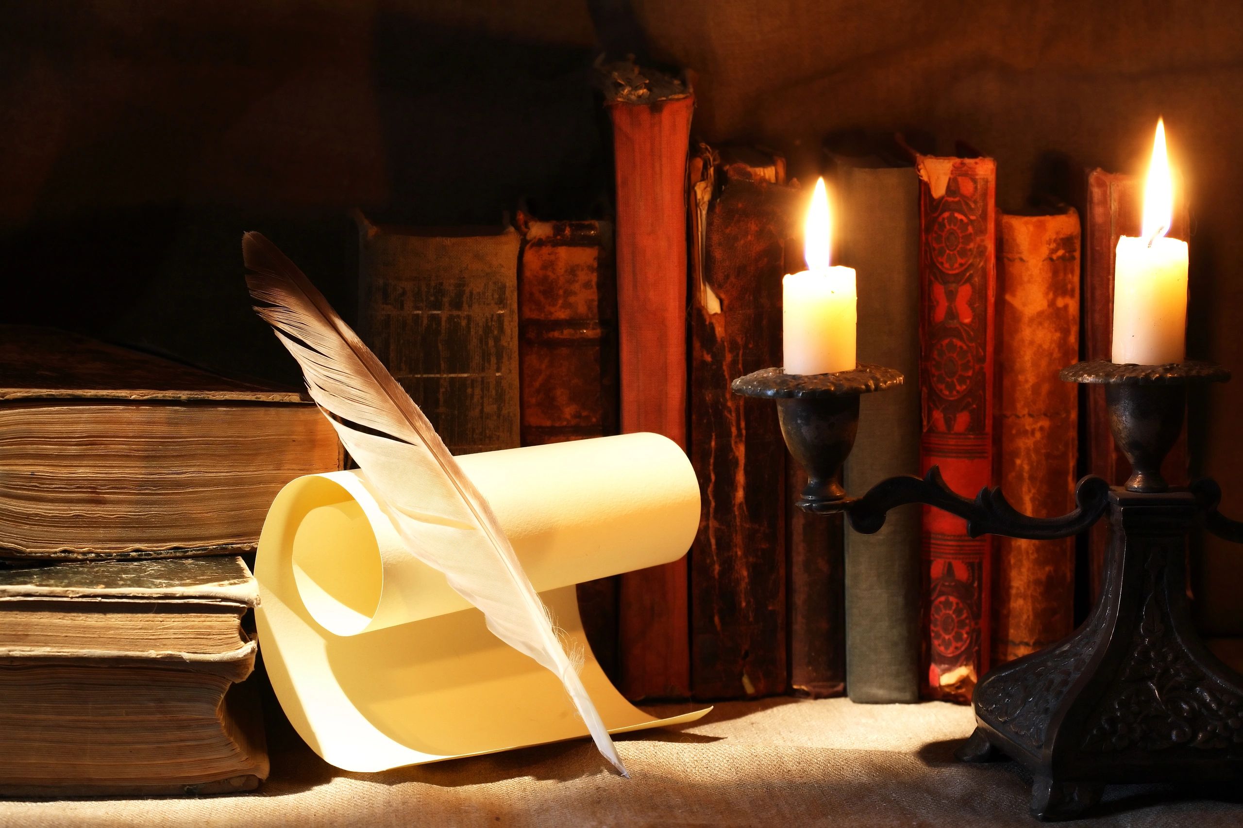 Old books and candlelight evoking preserved family records and heritage